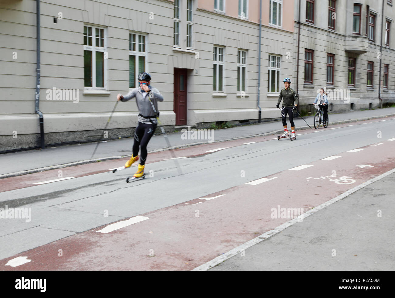 Trondheim, Norway - September 26, 2015: Two males on rollerskis near the university. Stock Photo