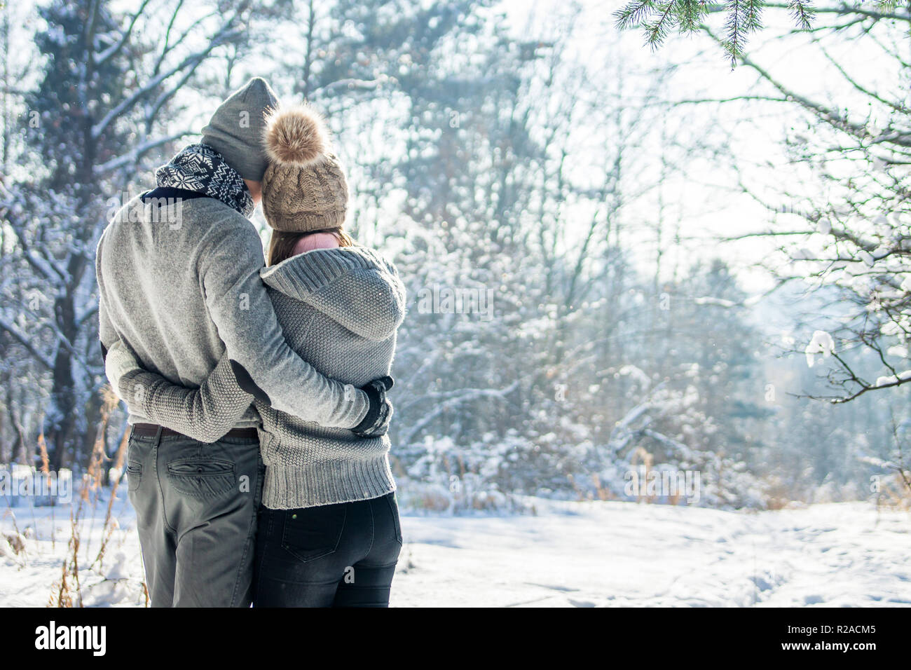 Couple in love hugs in winter forest. Romantic date Stock Photo - Alamy