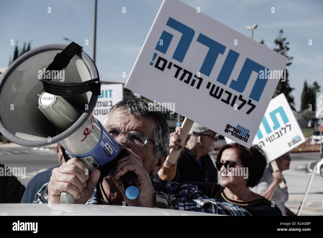 Jerusalem, Israel. 18th November, 2018. Israel Police pensioners, retired prison officers and the Association of Wives of Policemen and Correction Facilities Officers demonstrate in front of the PM's Office demanding government immediately implement a 1979 agreement backed by a 2017 Labor Court ruling ordering they receive a raise in salaries and retirement benefits retroactively. Protesters blocked the main entrance to the PM's Office and occasionally a main junction nearby. Credit: Nir Alon/Alamy Live News Stock Photo