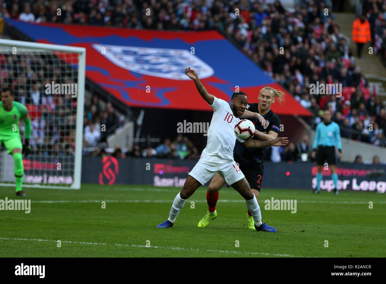 London, UK. 18th November 2018. Raheem Sterling of England is held back by Domagoj Vida of Croatia. UEFA Nations league A, group 4 match, England v Croatia at Wembley Stadium in London on Sunday 18th November 2018.  Please note images are for Editorial Use Only. pic by Andrew Orchard/Alamy Live news Stock Photo