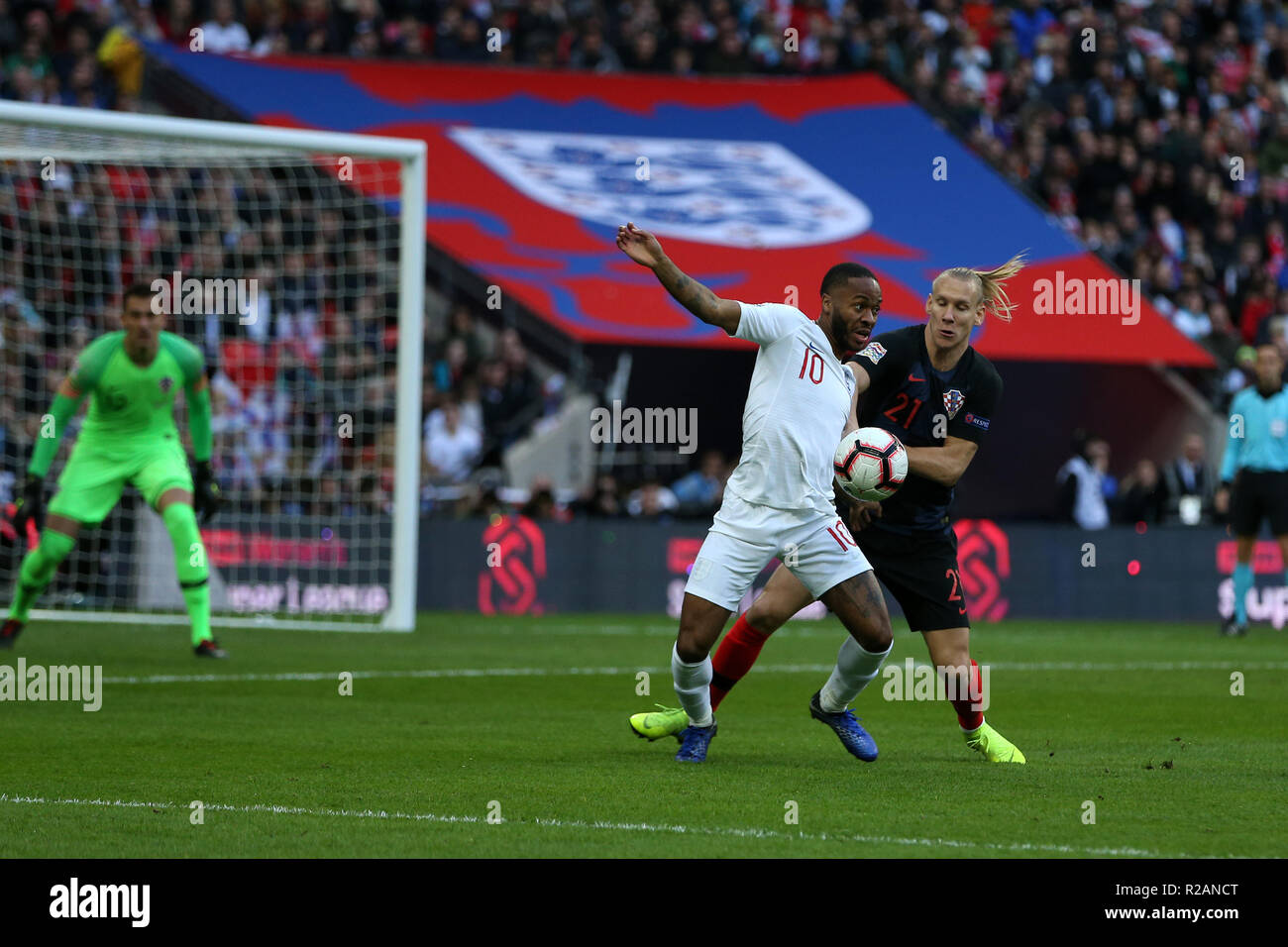 London, UK. 18th November 2018. Raheem Sterling of England is held back by Domagoj Vida of Croatia. UEFA Nations league A, group 4 match, England v Croatia at Wembley Stadium in London on Sunday 18th November 2018.  Please note images are for Editorial Use Only. pic by Andrew Orchard/Alamy Live news Stock Photo