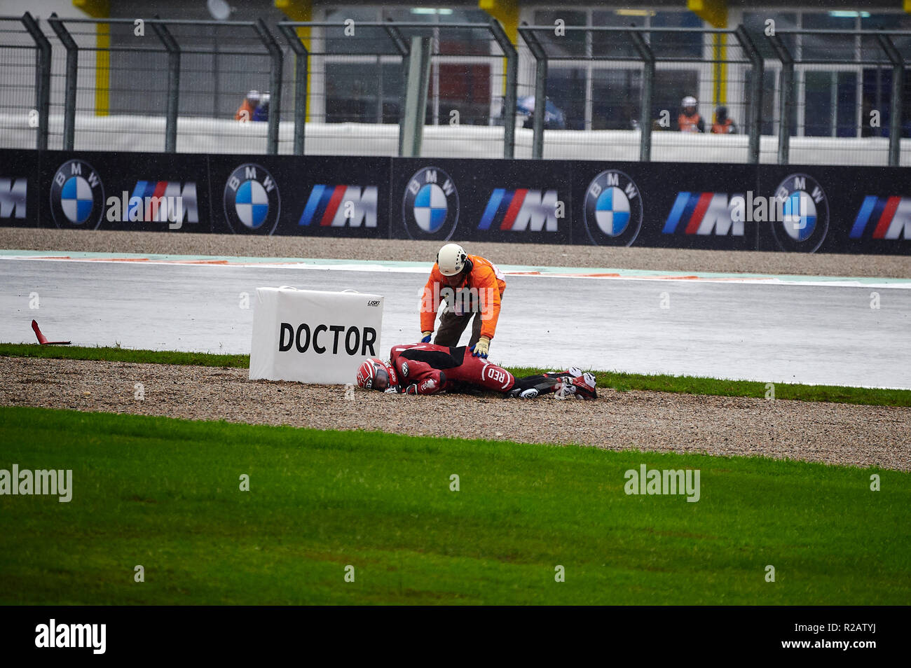 Circuit de Valencia, Valencia, Spain. 18th Nov, 2018. MotoGP of Valencia, race day; Aleix Espargaro of the Aprilia Racing Gresini Motogp Team is helped by a marshal after suffering a fall during the MotoGP Grand Prix Credit: Action Plus Sports/Alamy Live News Stock Photo