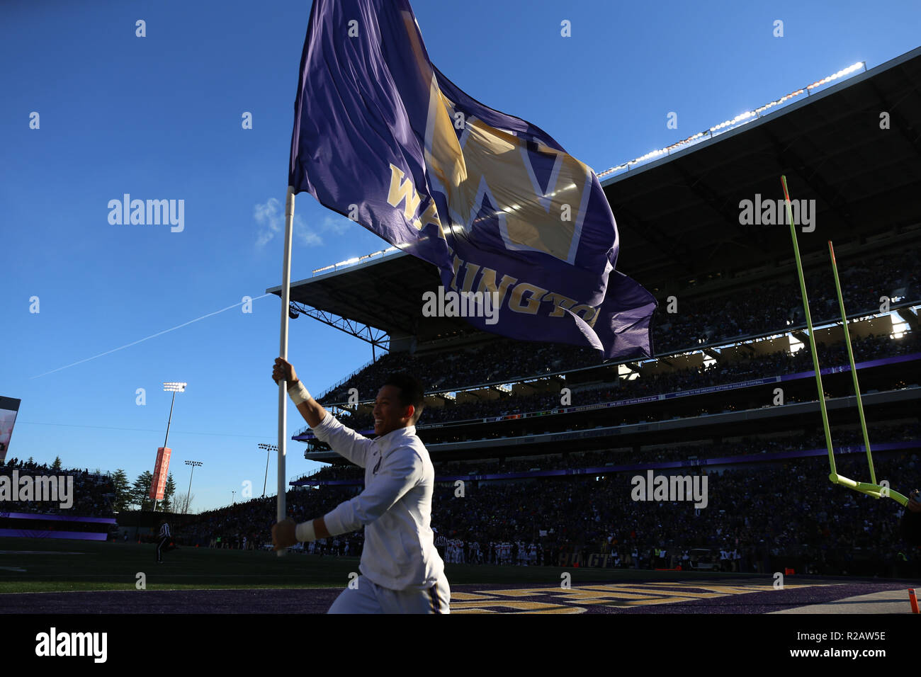Seattle, WA, USA. 17th Nov, 2018. The Washington Huskies Spirit Squad runs the flag on the sideline during a game between the Oregon State Beavers and Washington Huskies at Husky Stadium in Seattle, WA. The Huskies defeated the Beavers 42-23. Sean Brown/CSM/Alamy Live News Stock Photo