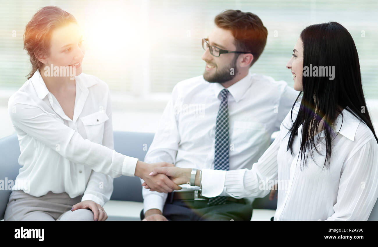 handshake of manager and client in the office lobby Stock Photo - Alamy