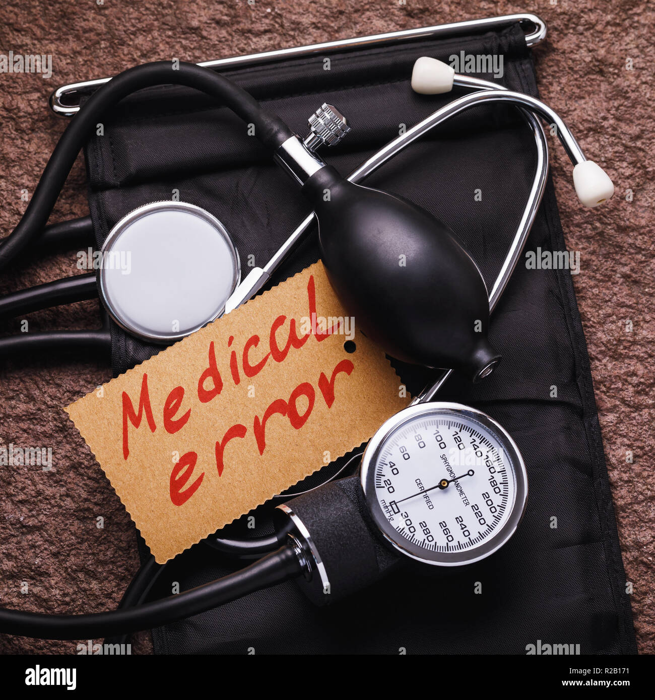 Medical equipment for measuring blood pressure and a sticker that says medical errors Stock