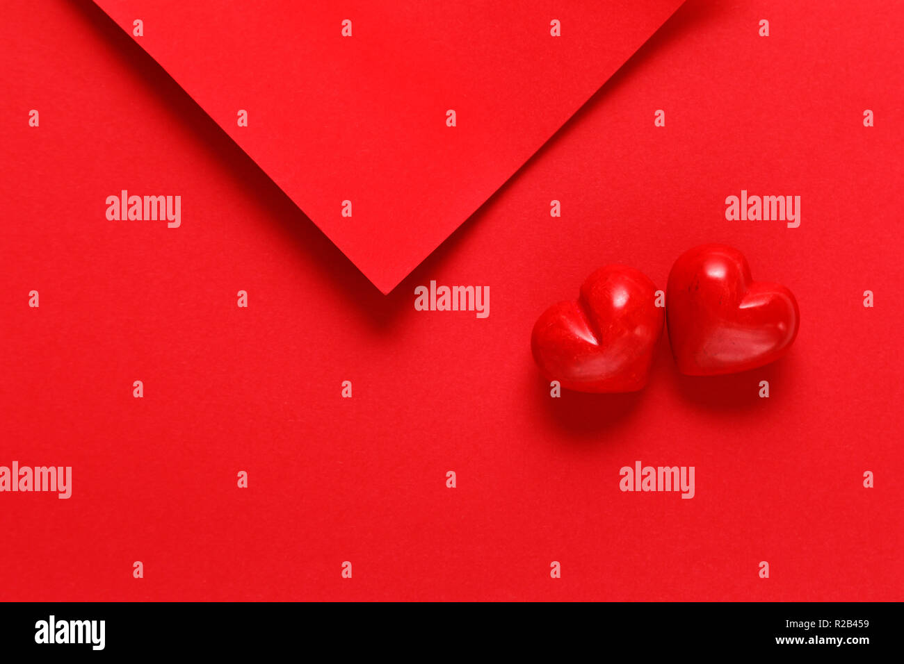 red paper sheets with two red hearts Stock Photo - Alamy