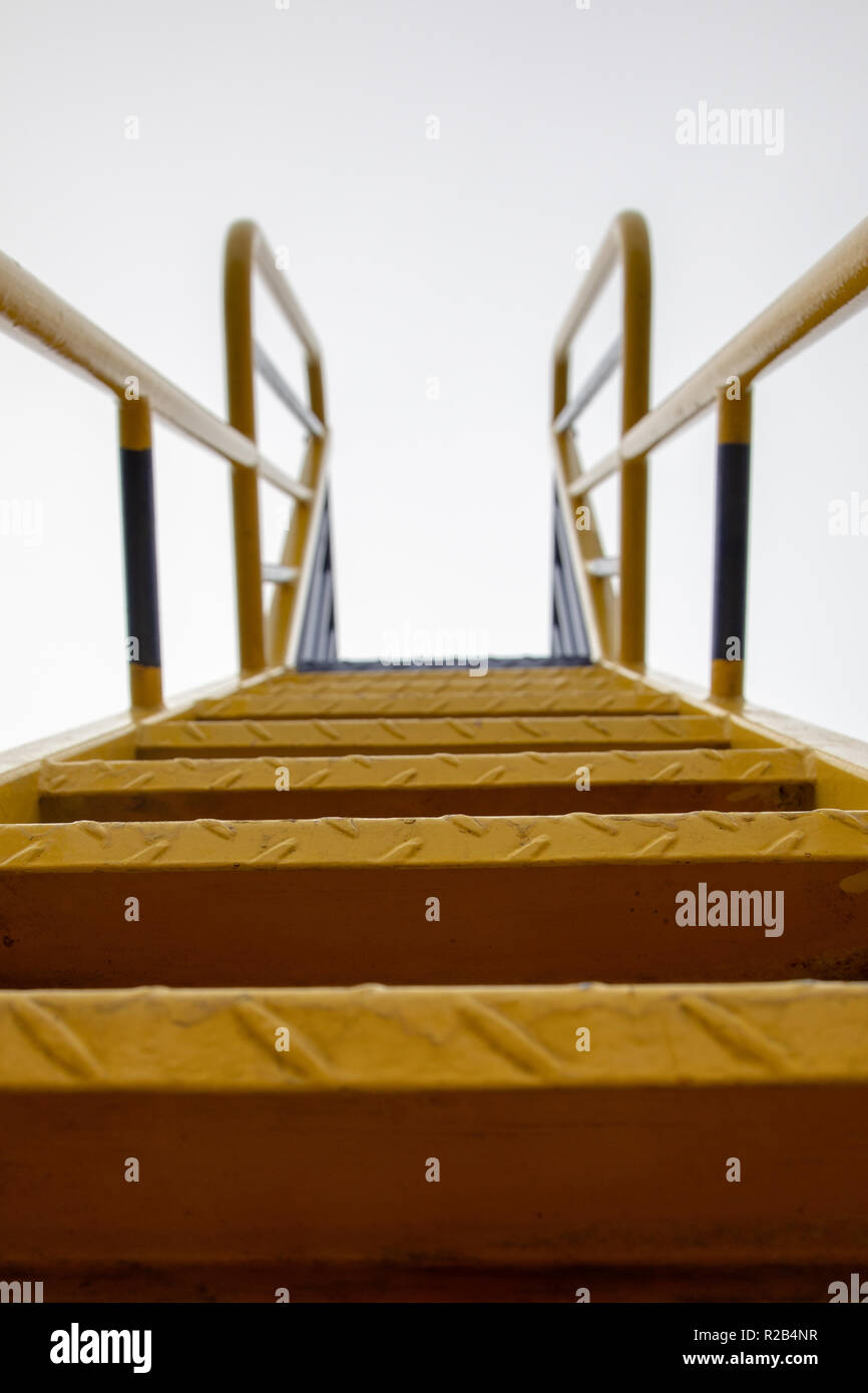 metal steps of a playground slide UK Stock Photo