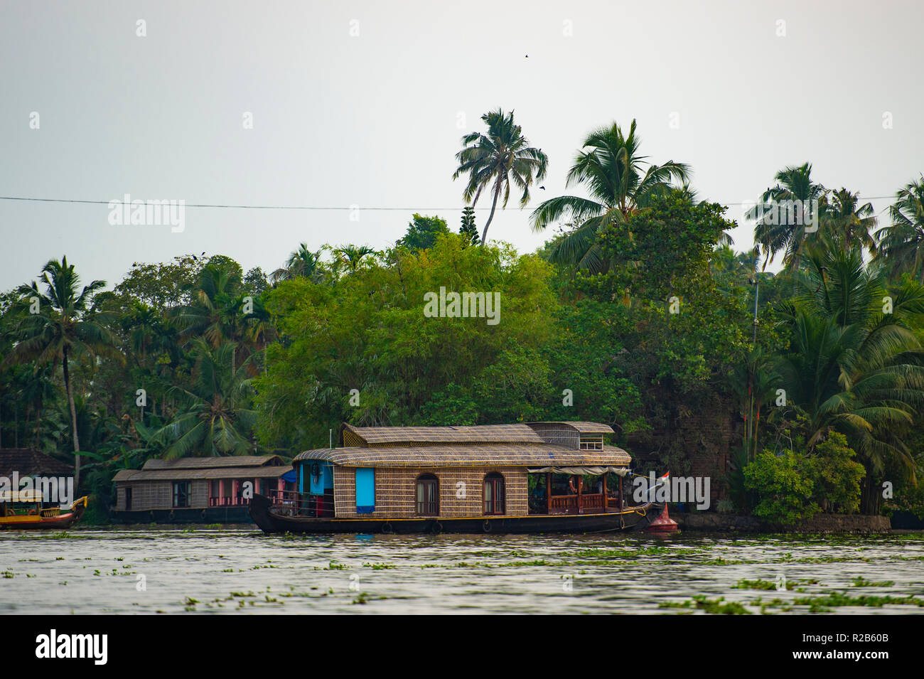 A beautiful houseboat is sailing among Alleppey's backwaters, Kerala, India. Stock Photo