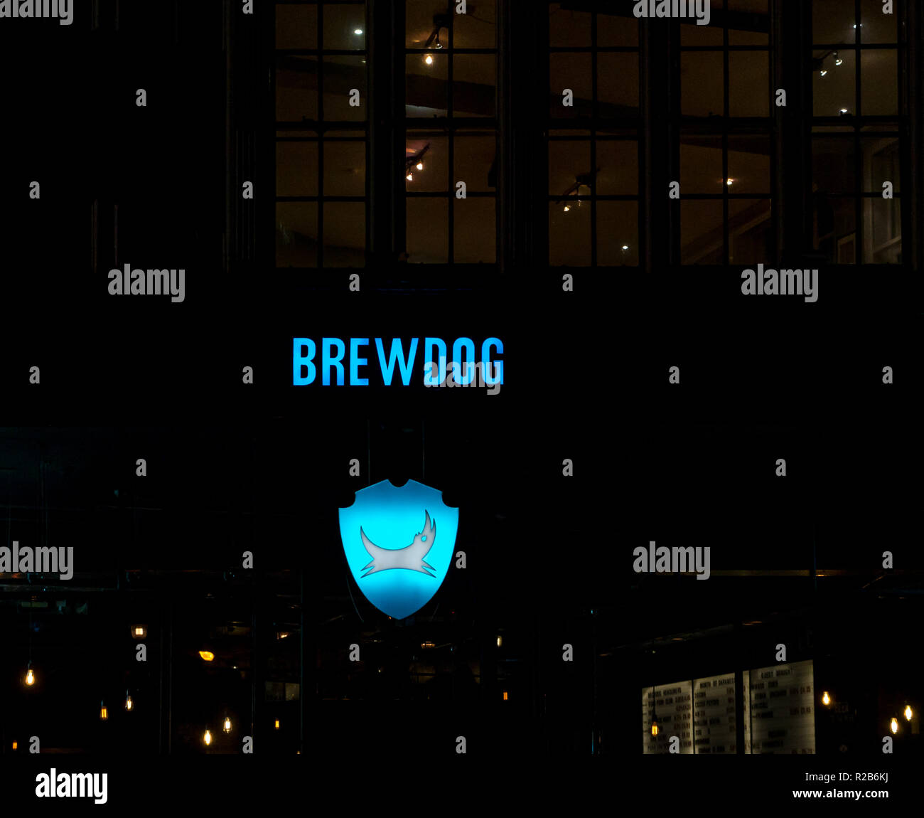 Bright blue neon sign lit up at night for Brewdog pub, Newcastle, England, UK Stock Photo