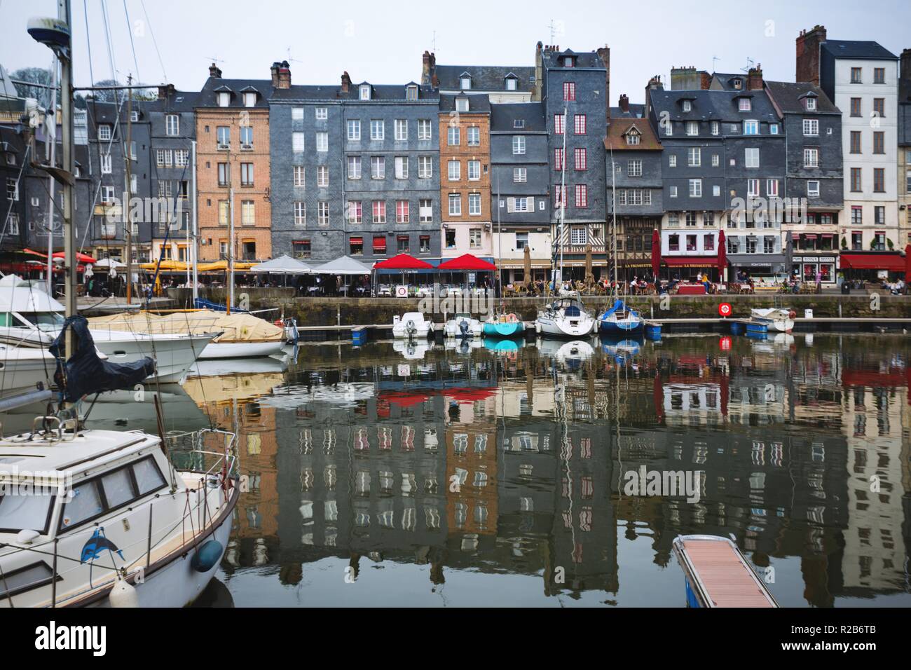 HONFLEUR, FRANCE - APRIL 8, 2018: view of the bay and the embankment  in the famous French city Honfleur. Normandy, France Stock Photo