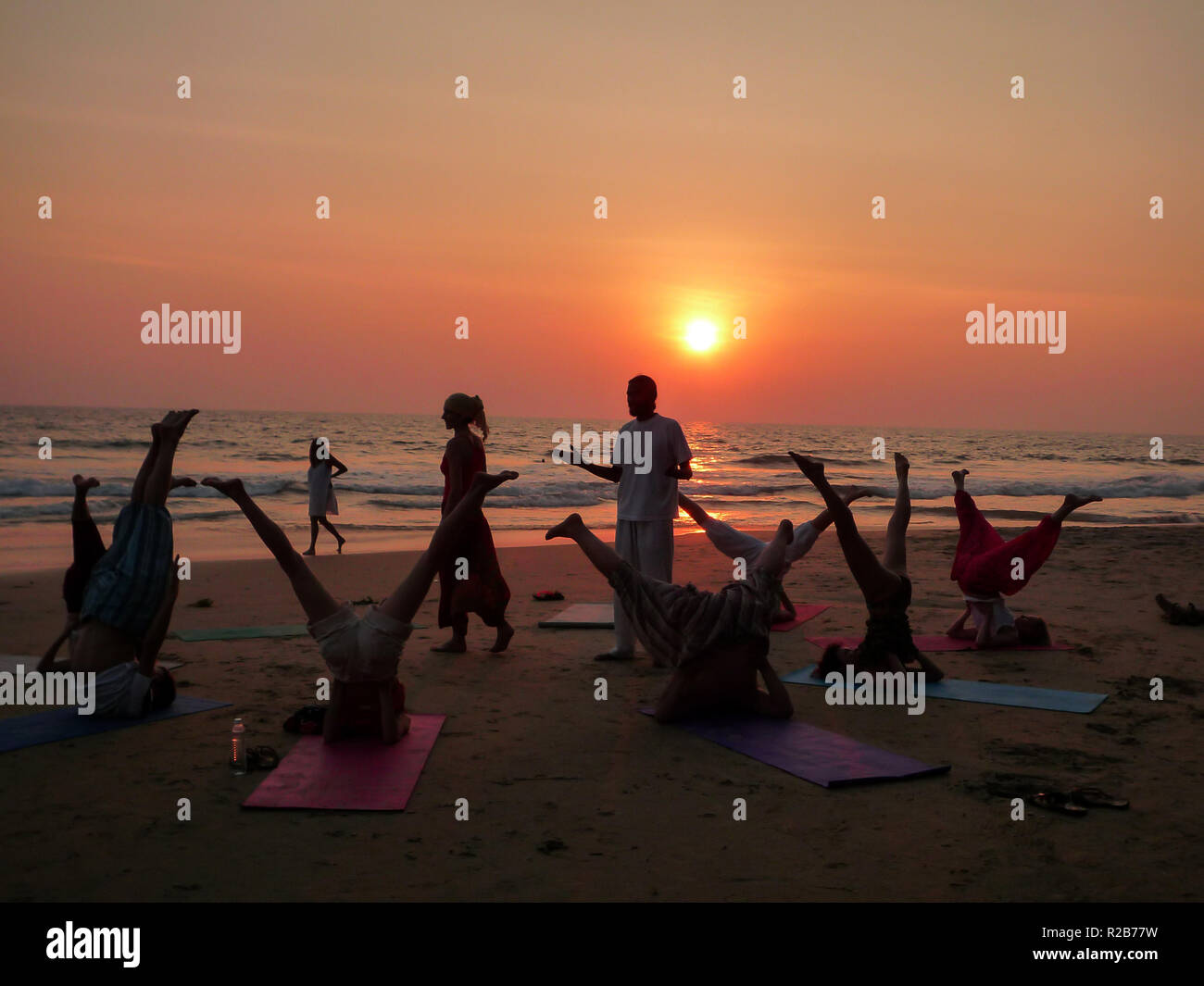 India, Kerala, Varkala, 01/31/2009 Yoga class on the Varkala beach at sunset Stock Photo Alamy