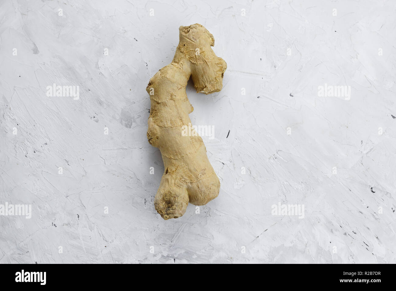 top view ginger on a white concrete shabby  background flat lay minimalism Stock Photo