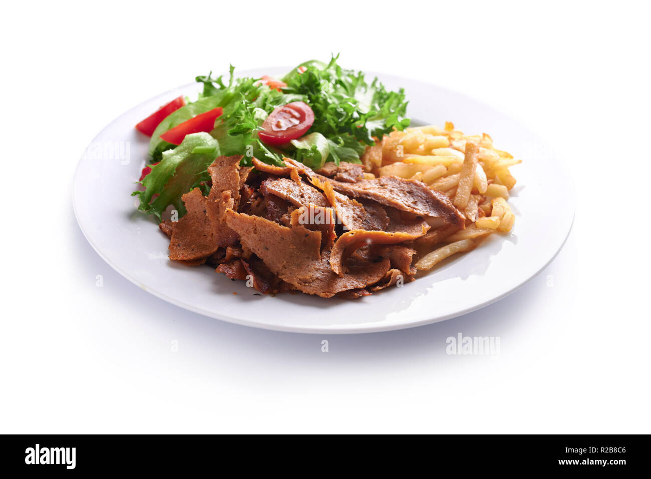 veggie meat free doner, fried potato and salad on plate isolated on white background Stock Photo