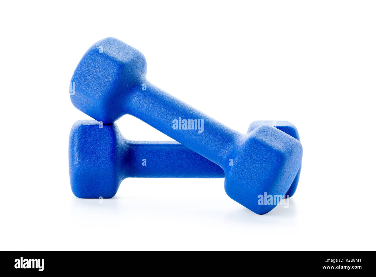 Two small blue dumbbells isolated on white background, clipping-path included, excluding the cast shadow Stock Photo