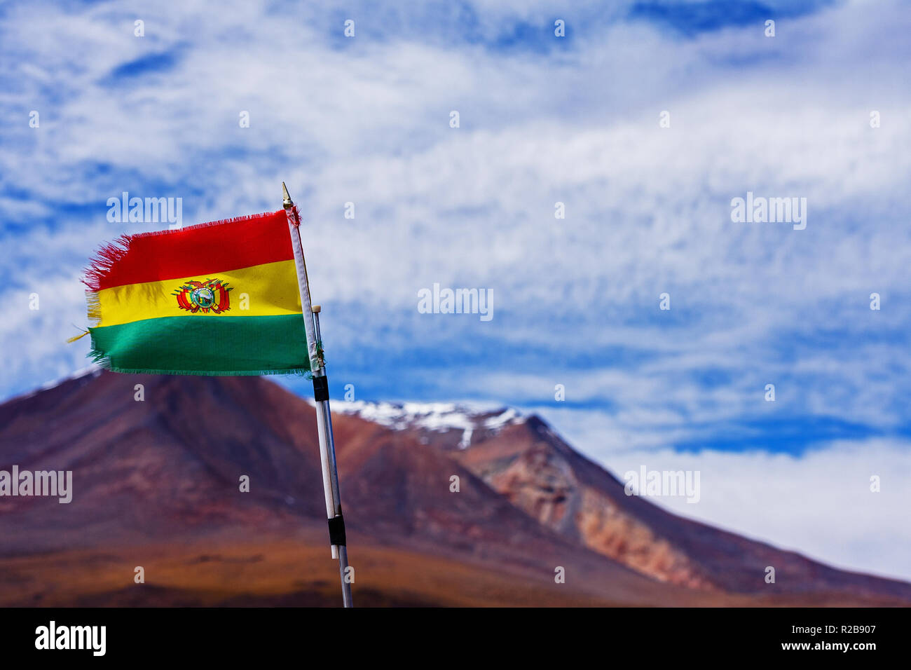 Bolivian waving flag at the mountains at Mirador Ollague, Bolivia Stock Photo