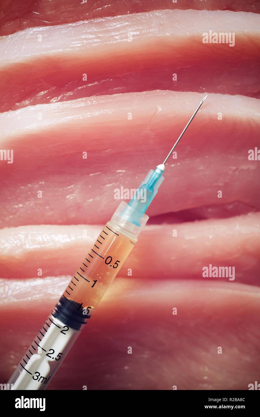 Hormone manipulation with syringe of meat Stock Photo Alamy