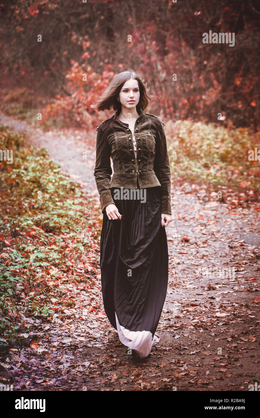 Woman long skirt walking away hi-res stock photography and images - Alamy