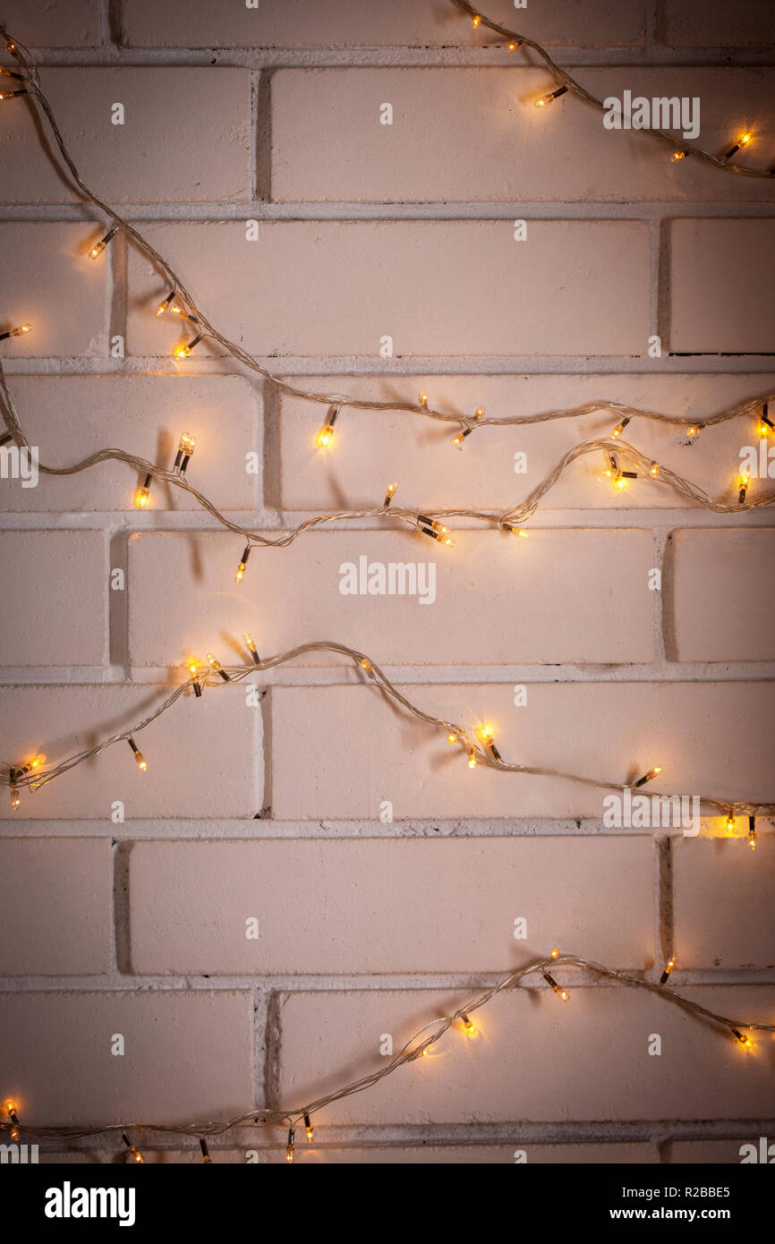 brick wall decorated with garland Stock Photo Alamy
