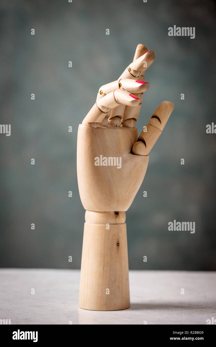 wood mannequin arm on a gray Stock Photo - Alamy