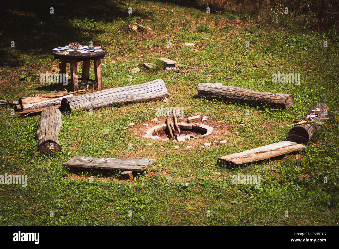A fire pit and round seating area. Stock Photo