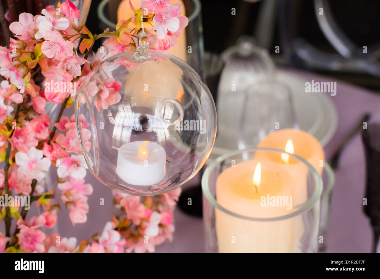 Wedding decoration for banquet with sakura and candles Stock Photo