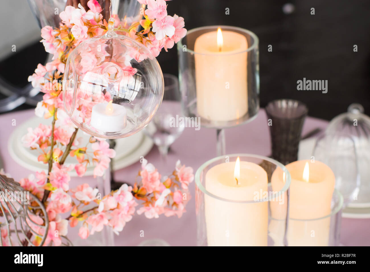 Wedding decoration for banquet with sakura and candles Stock Photo