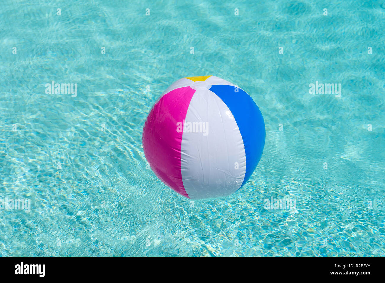 A beach ball in the swimming pool Stock Photo - Alamy