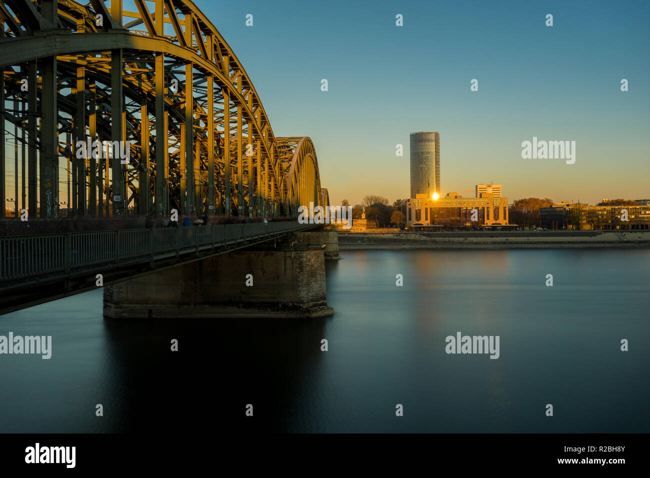 View of the Hohenzollern Bridge, the Hyatt Regency, the Cologne Triangle and the long River Rhine at the Blue Hour in Germany Cologne 2018. Stock Photo