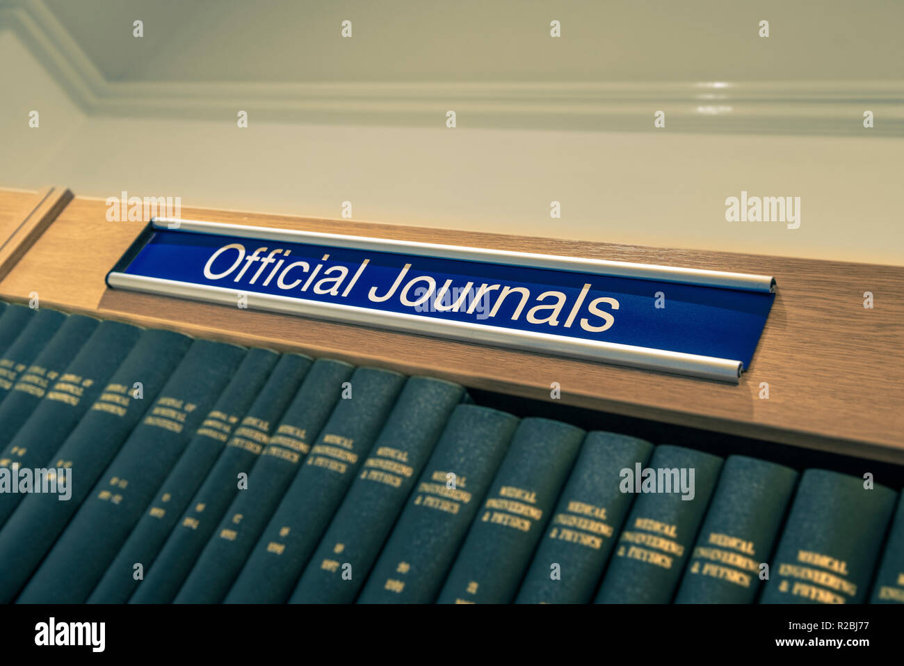 Official Journals sign above shelf full of books in library Stock Photo