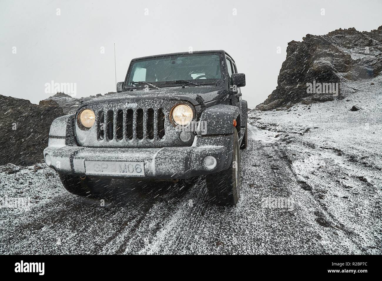 Jeep Wrangler on Icelandic terrain with snow Stock Photo