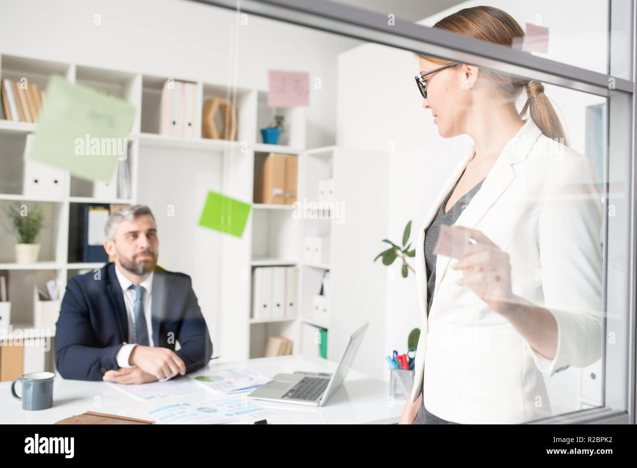 Business lady presenting idea to creative director Stock Photo