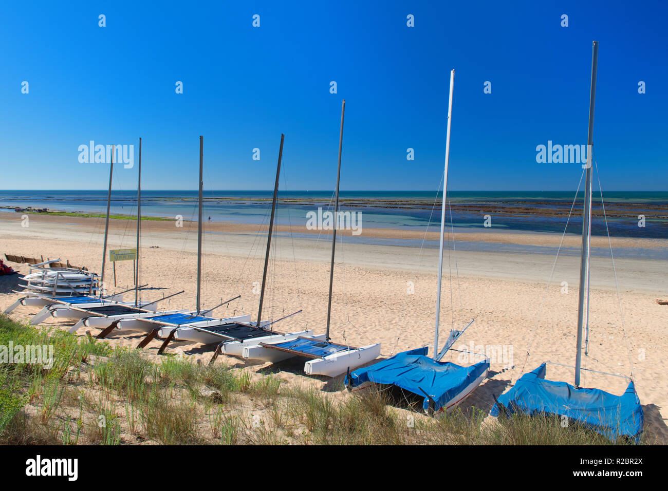 Ile de Rée- Beach landscape sand and sea with sailboats at the horizon ...