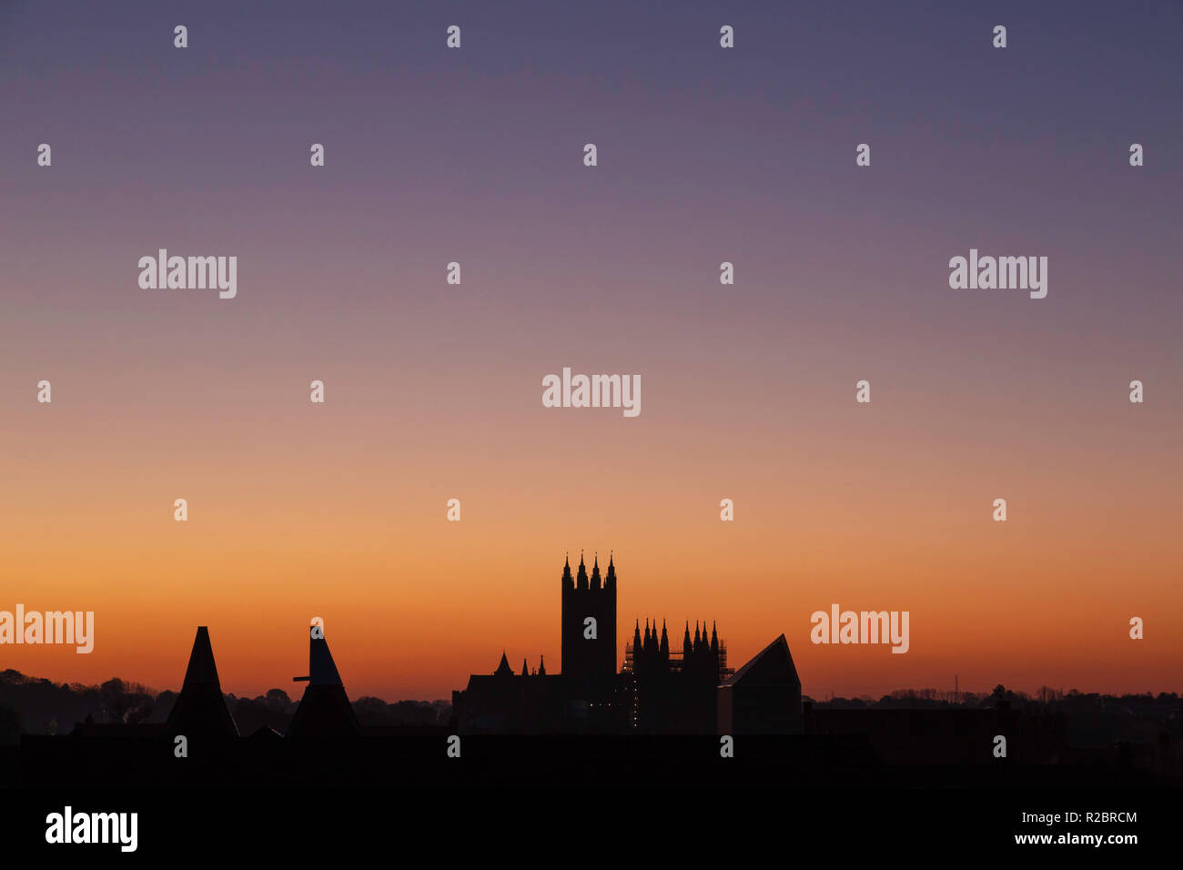 Just before sunrise during November looking towards a silhouetted Canterbury Cathedral, Canterbury, Kent, UK. Stock Photo