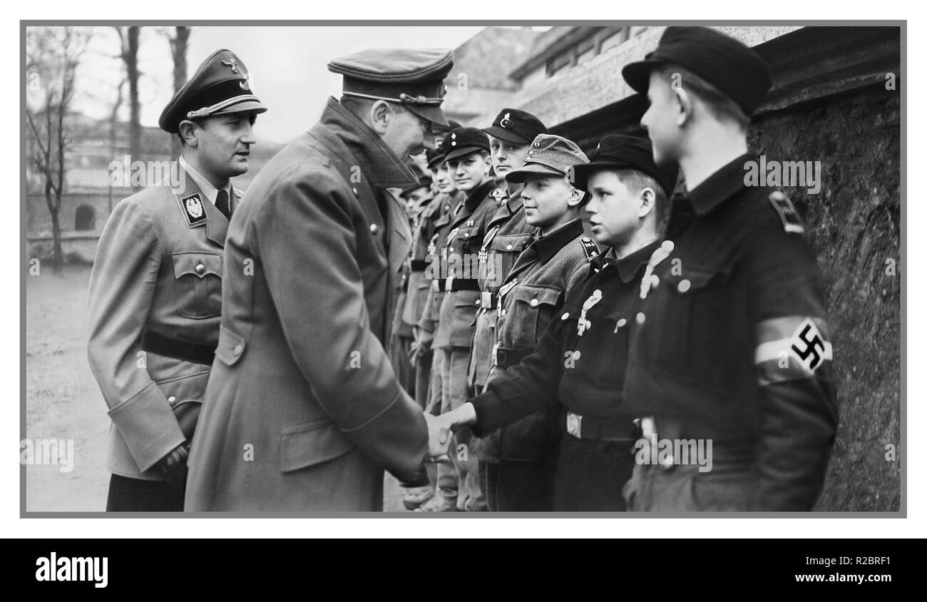 BERLIN Adolf Hitler end of World War II One of last public appearances and image of Adolf Hitler meeting and awarding medals to Hitler Jugend, young indoctrinated teenage active front-line youth fighting force, Hitler Youth Jugend used to slow the Russian Army advance on Nazi Berlin Germany April 1945 WW2 Stock Photo