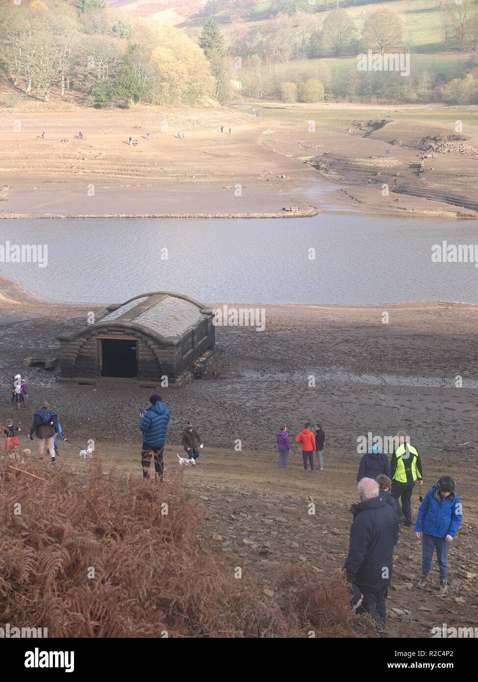 Curious crowds descend to what is normally the bottom of Ladybower Reservoir to explore remains of Derwent Village, exposed following 2018 heatwave Stock Photo