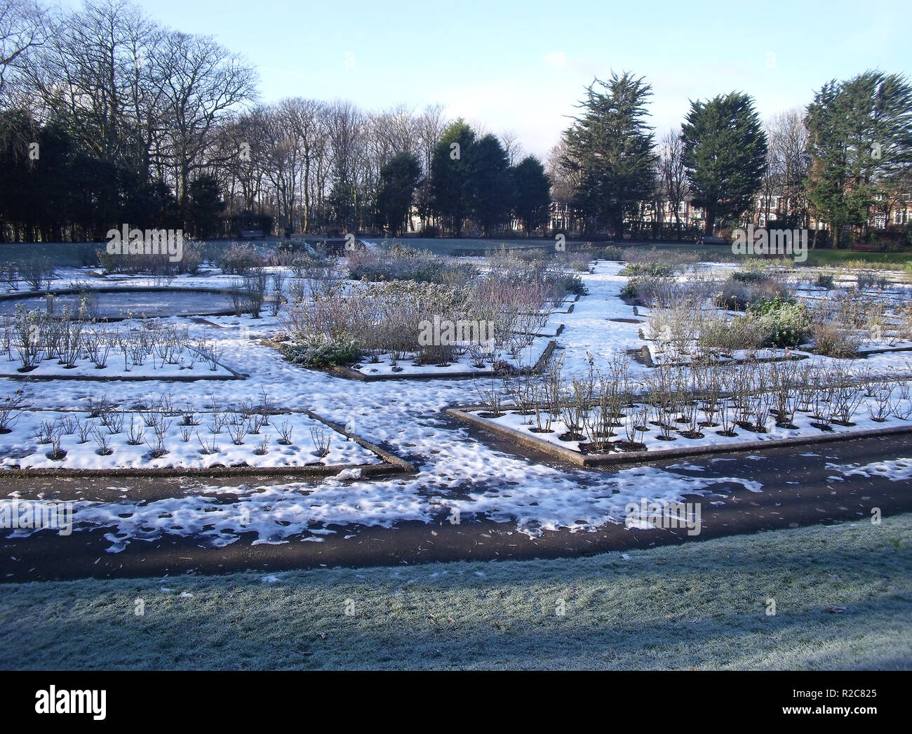 Winter snow covered Rose Garden beds in Stanley Park Blackpool