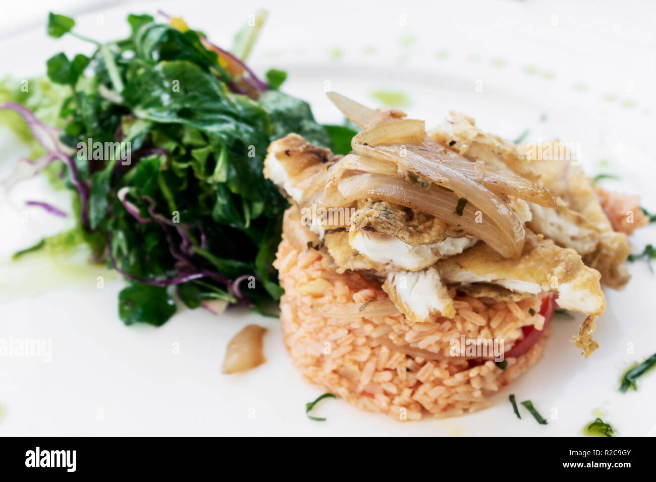 Portuguese fish in Escabeche sauce with tomato rice traditional gourmet