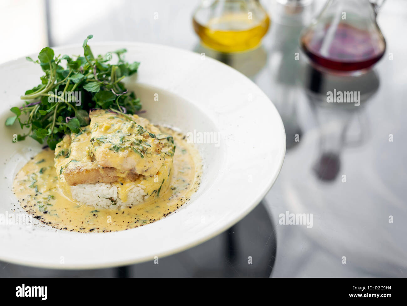 sea bream fish fillet in creamy mustard dill and lemon sauce restaurant meal on plate Stock Photo