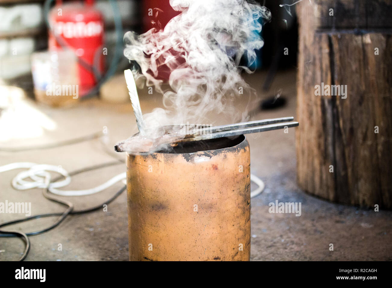 steam comes from the tool at forge Stock Photo - Alamy