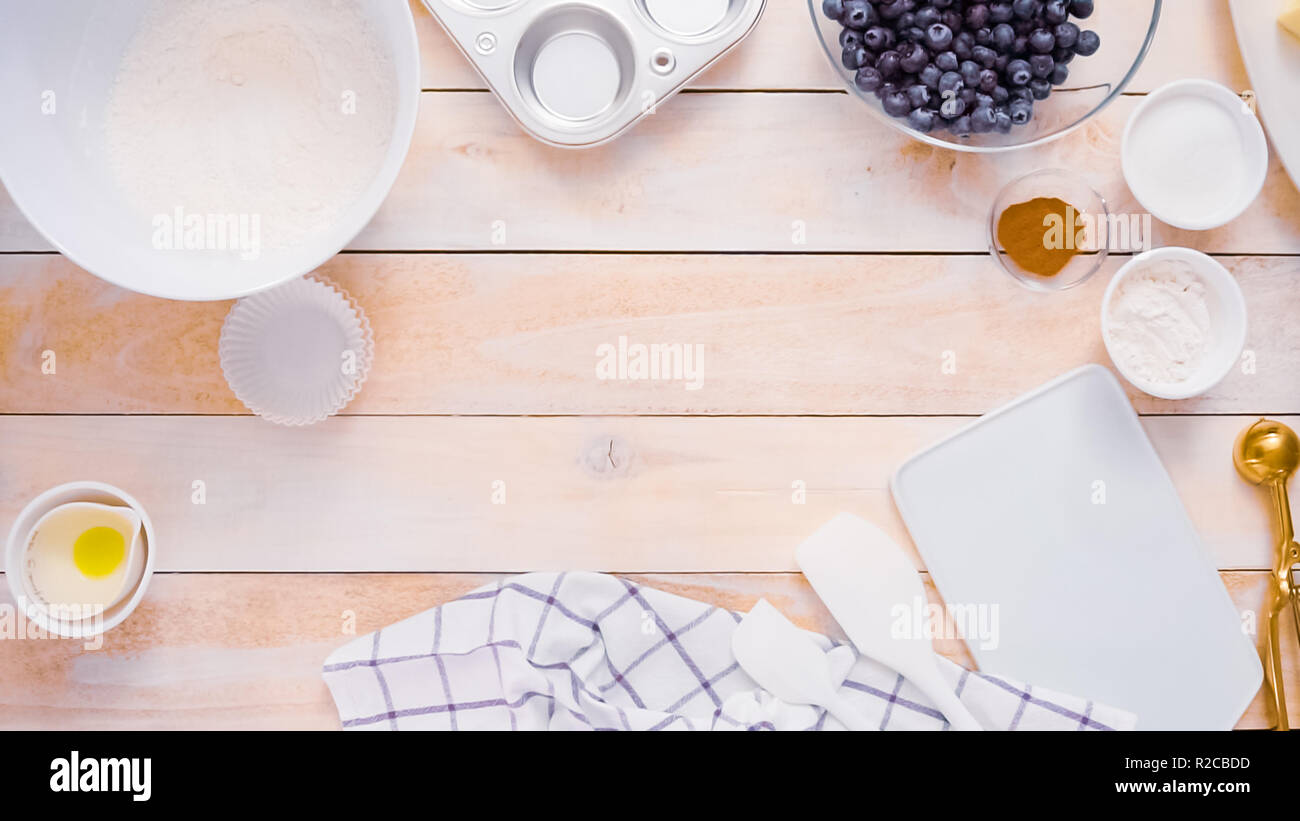 Mixing ingredients together in mixing bowl for blueberry muffins Stock