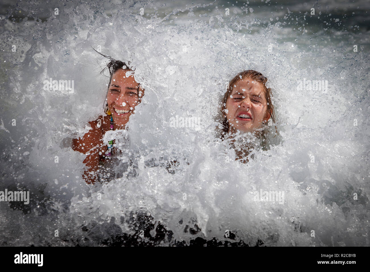 Body surfing and waves in Hawaii with smiling faces Stock Photo Alamy