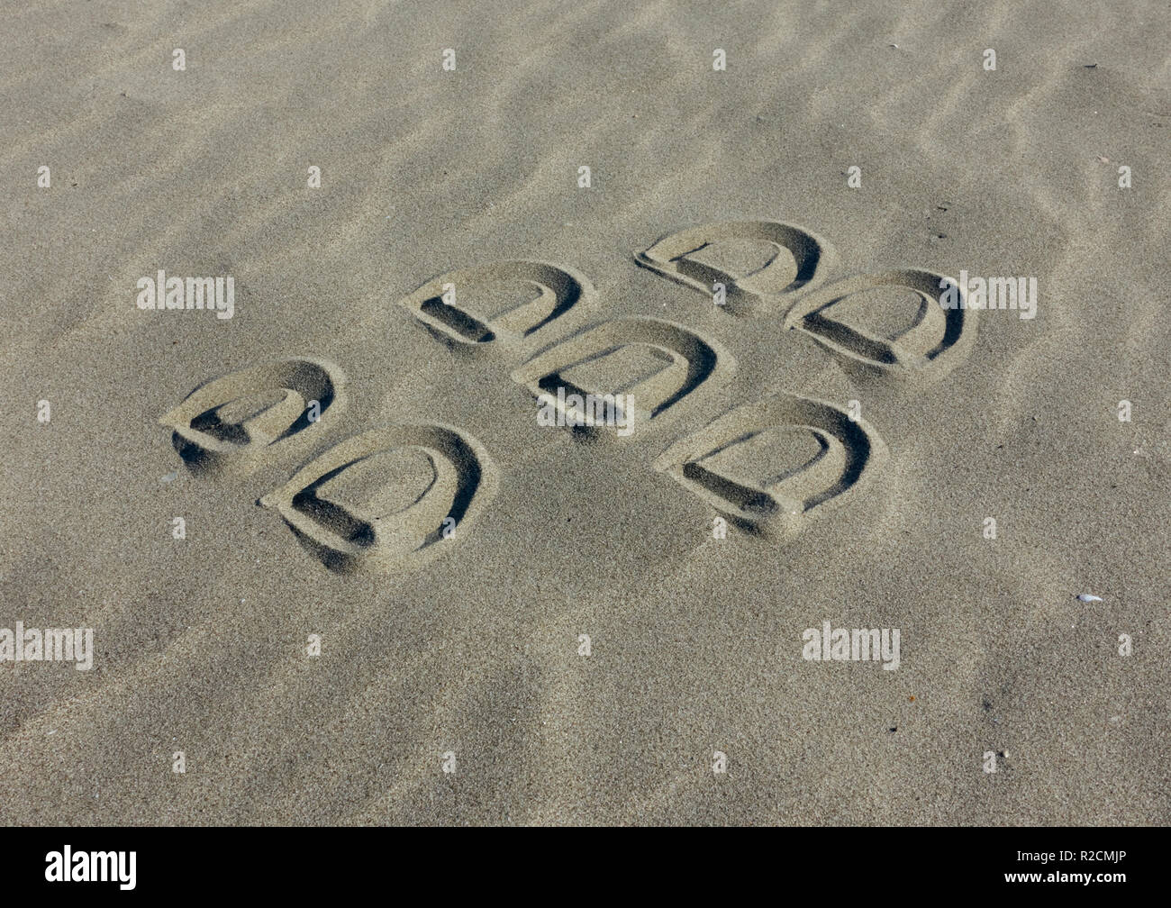 Blackberry logo brand sketched on the sand Stock Photo