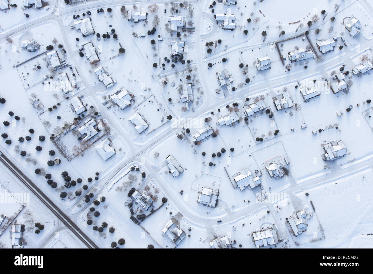 Aerial shot of a snow covered neighborhood in winter Stock Photo