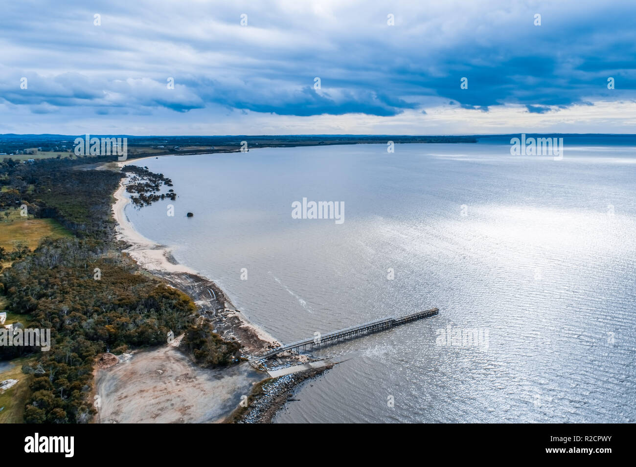 Long pier and ocean coastline with mangroves Stock Photo