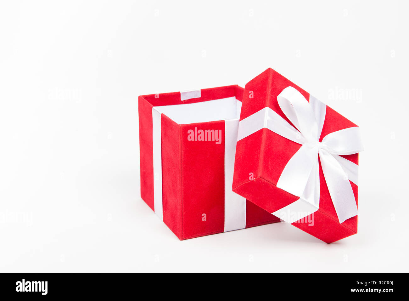 Red gift box isolated on white background Stock Photo - Alamy