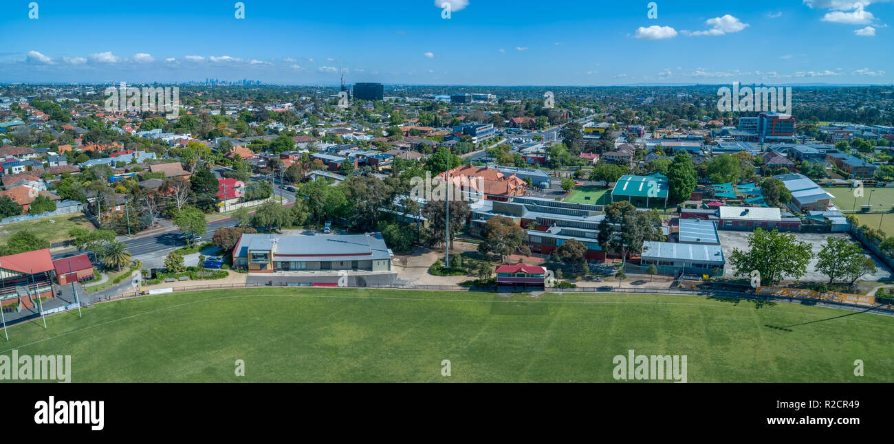 Aerial panorama of Melbourne suburbs and sports oval on bright sunny day Stock Photo