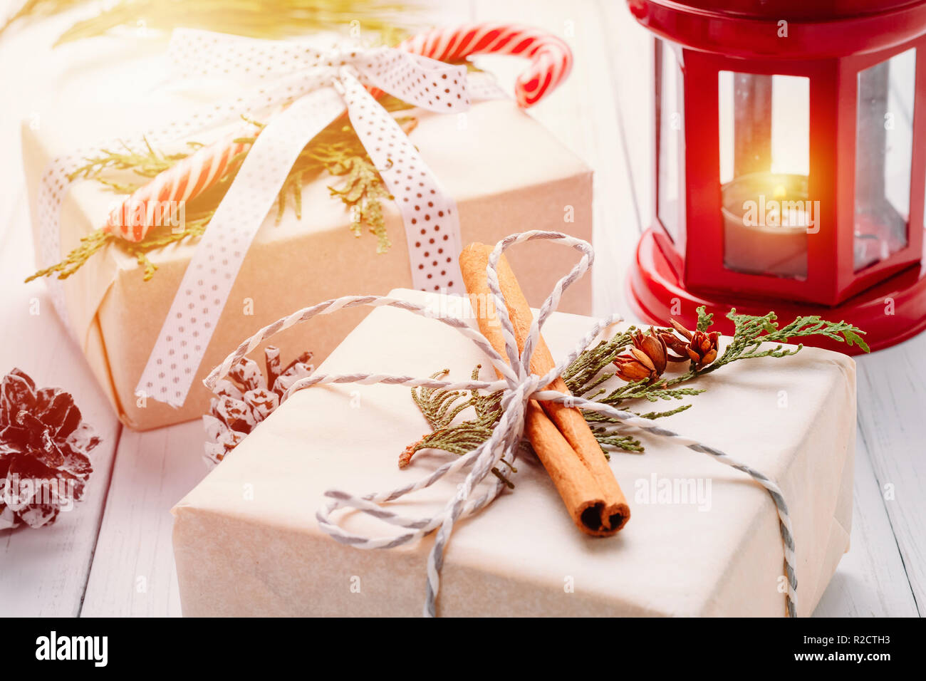 Christmas decorations with gift boxes, pine cones and lantern with ...