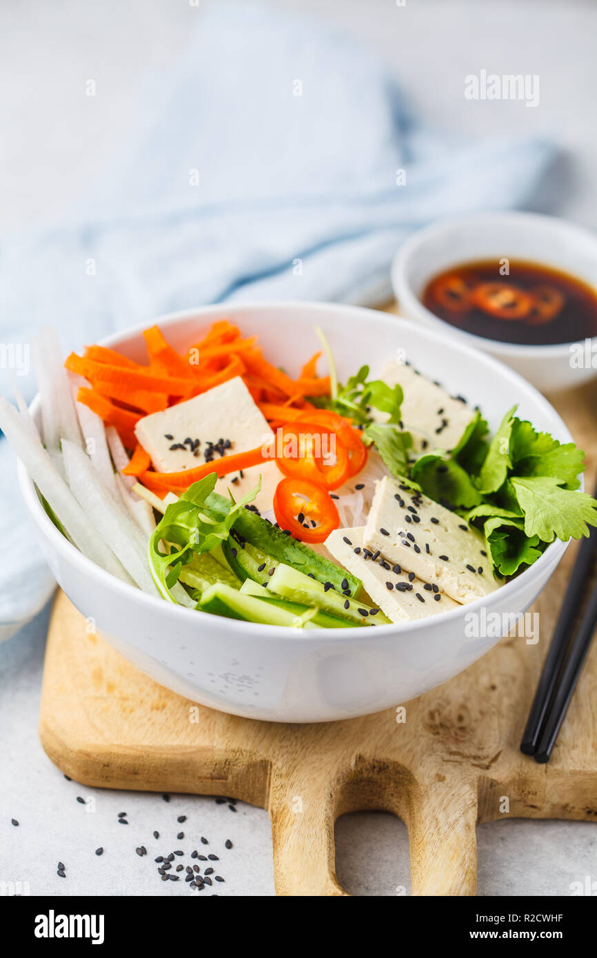 Vietnamese rice noodle with tofu and chilli vegetables salad in white