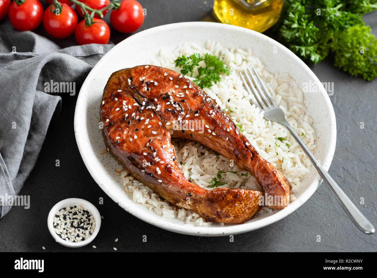 Teriyaki salmon steak with rice on white plate. Healthy food Stock Photo