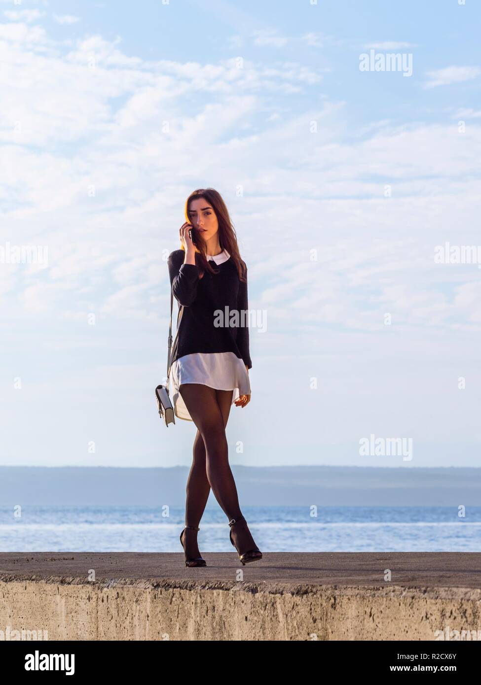 Adolescent teen aka young woman sexy legs heels Stock Photo - Alamy
